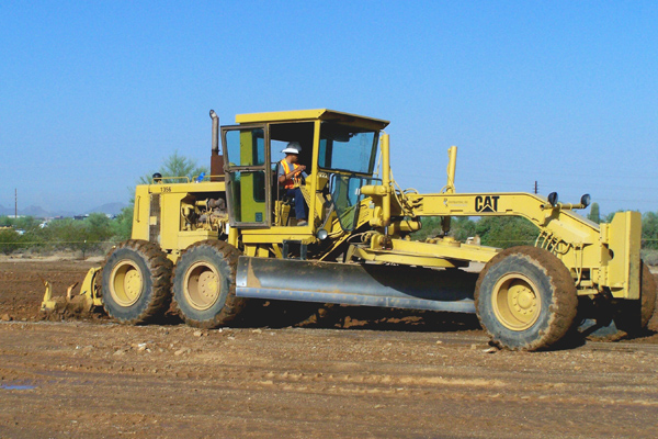 140G Blade prepping fill areas on a site at DC Ranch in the early days